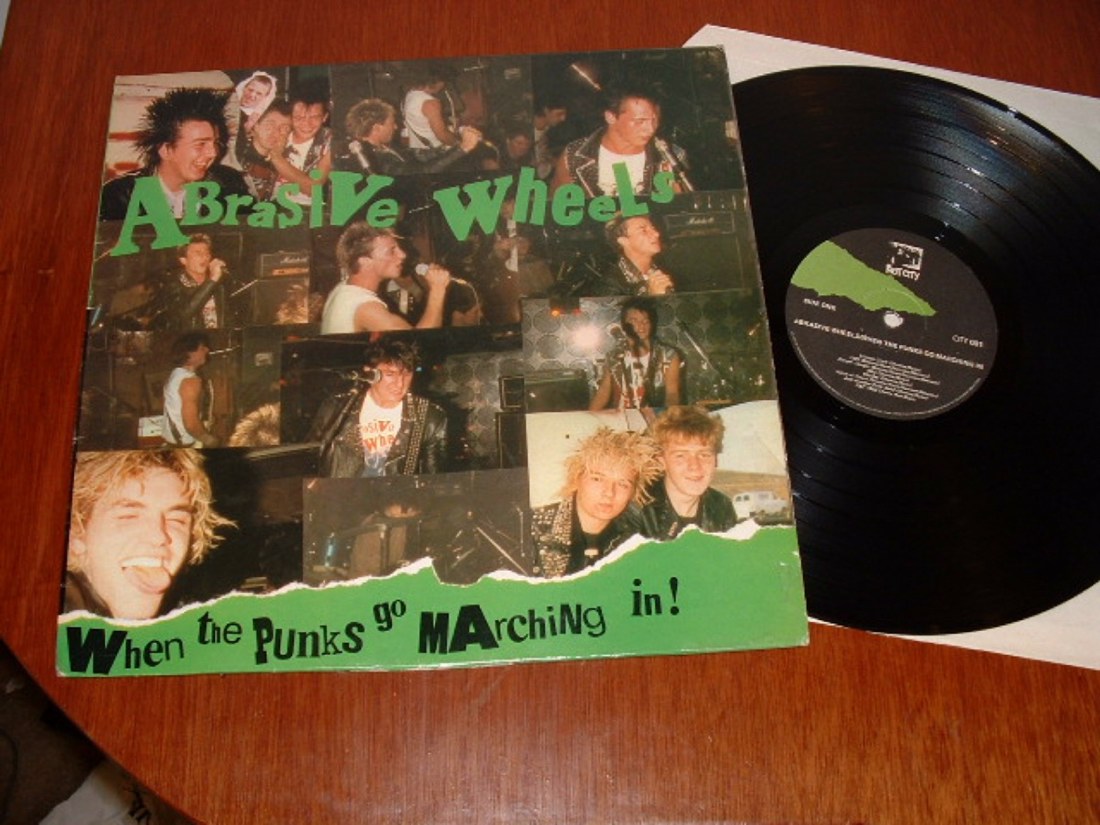 ABRASIVE WHEELSWHEN THE PUNKS GO MARCHING IN LP 1982 RIOT CITY RECORDS CITY001 (small scuffs